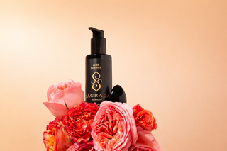 Sagrada Obsidian Yoni Egg and Lube for Her displayed with roses, representing feminine wellness, pelvic awareness, and intentional self-care ritual.