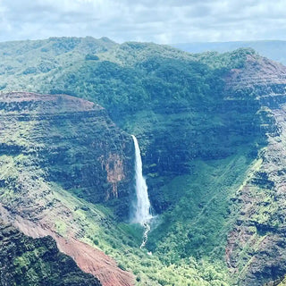 Image from a Waterfall, in Kauai surrounded by mountains 