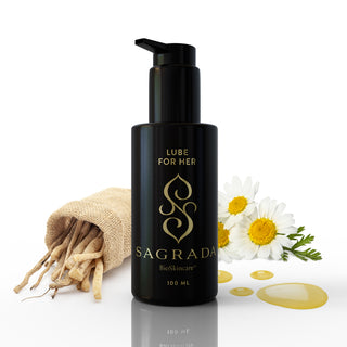 Sagrada Bioskincare lube for her bottle with camomile flowers and a bag of shatavari on a white background