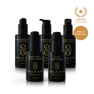 Sagrada Complete Reawakening Skincare System featuring Gold Day Serum, Bakuchiol Night Serum, Copper Vetiver Facial Mist, Micellar Frankincense Cleanser, and Cardamom Silver Cleanser award-winning mineral-enhanced set