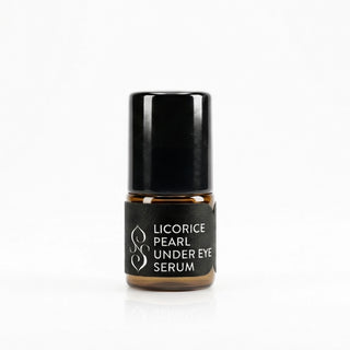 Sagrada Licorice Pearl Under Eye Serum in black glass packaging, designed to brighten, de-puff, and refresh the under-eye area